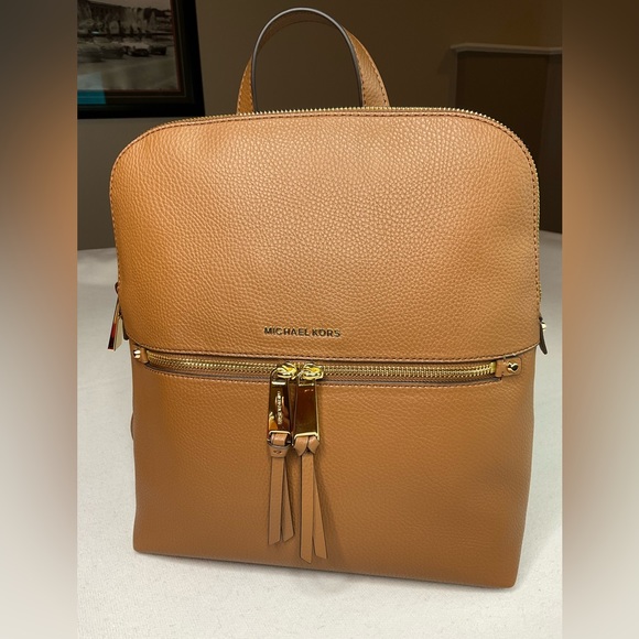 Michael Kors Handbags - NWT Luggage Color Medium Slim Michael Kors back pack